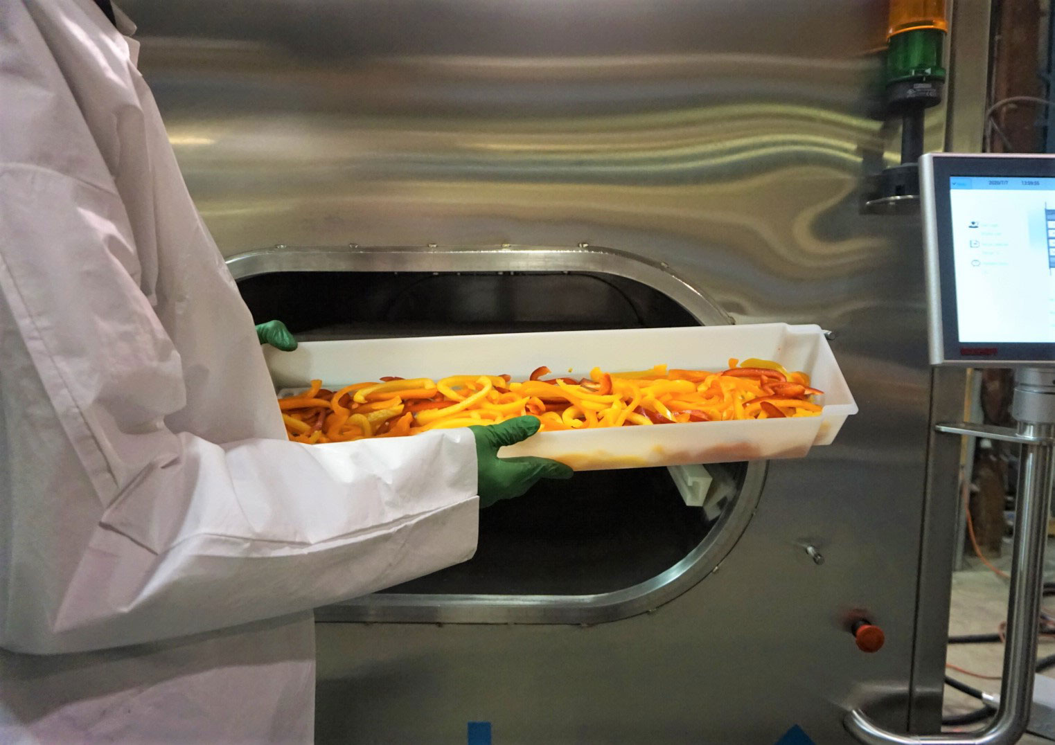 Freshly sliced vegetables in a tray before microwave processing in a NuWave Research vacuum microwave drying system.